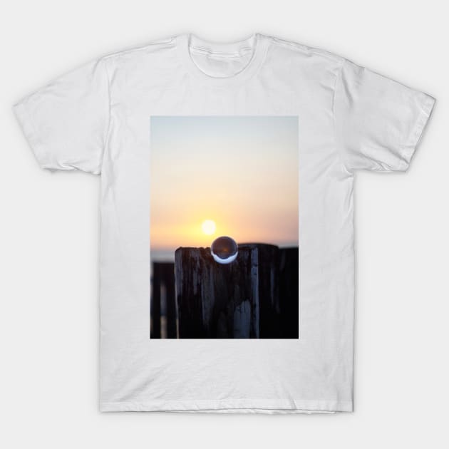 Glass ball at sunset T-Shirt by Matlasaya